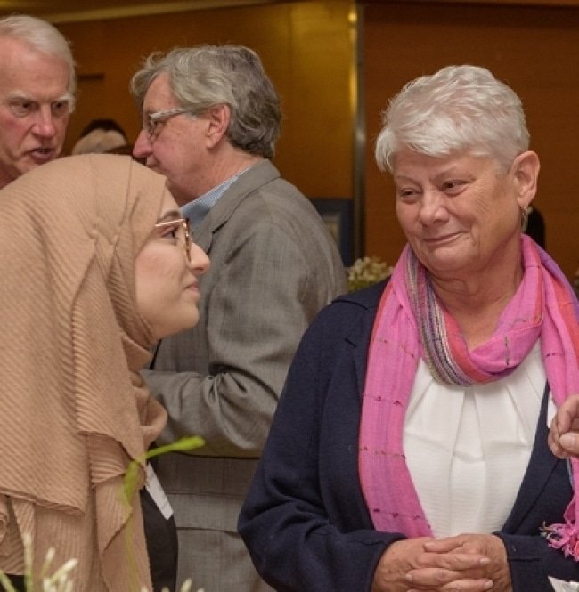 people talking at event