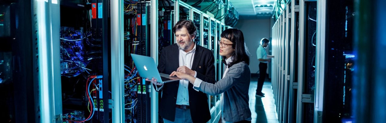 student and teacher working in a digital lab 